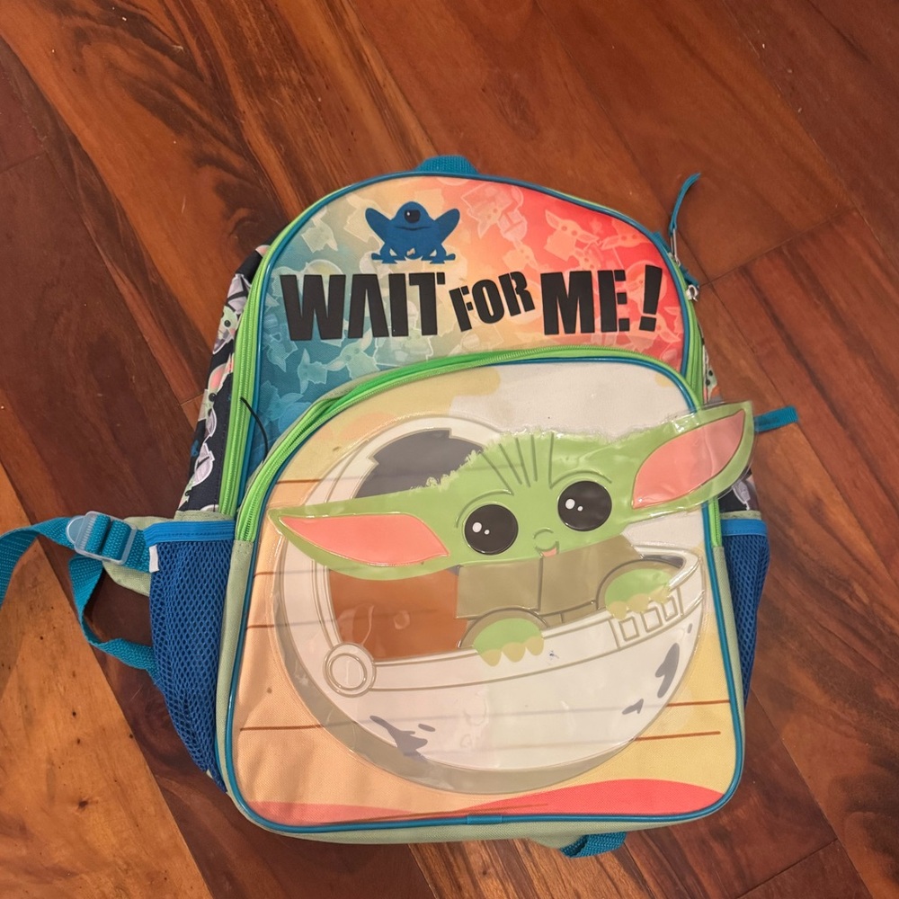 Like new Baby Yoda 16” backpack with 2 zipper pockets. Only used once.